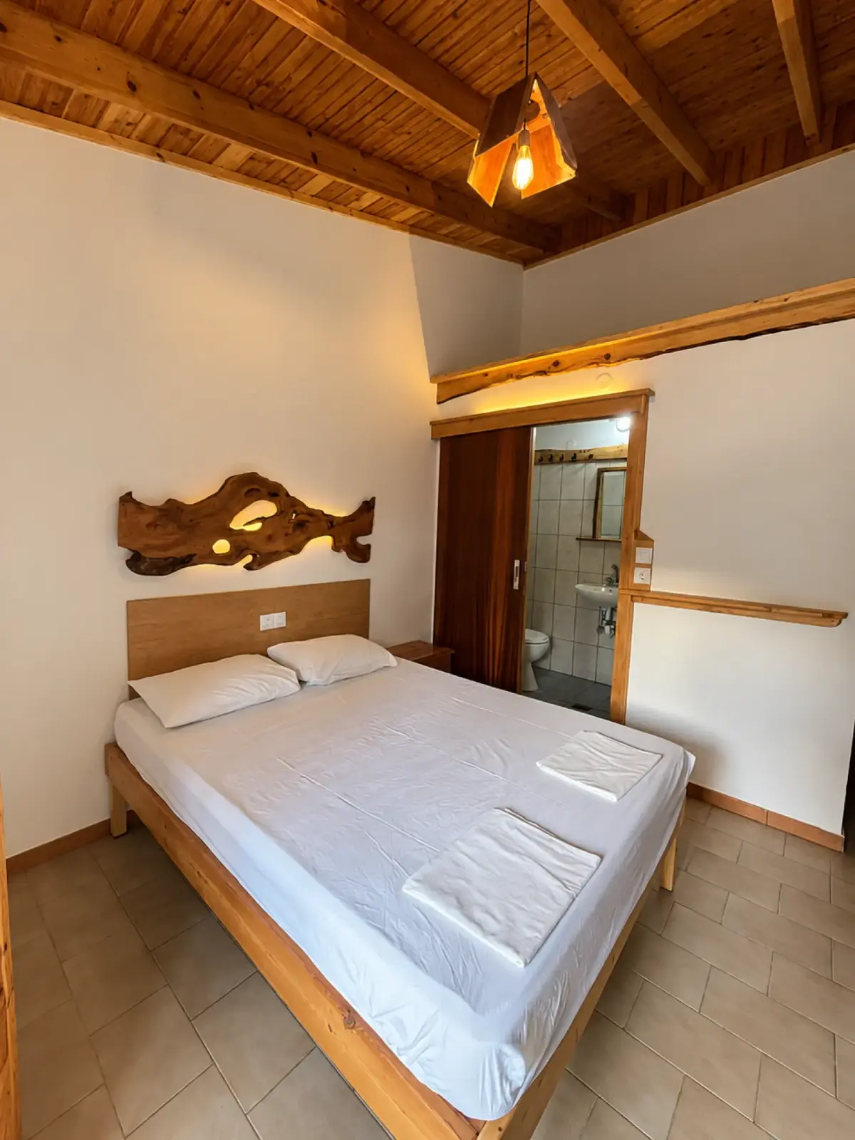 Guest bedroom with wooden furnishings